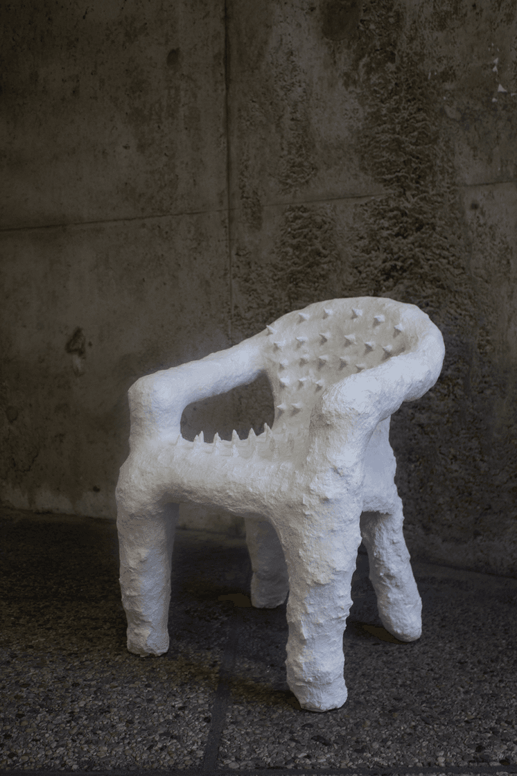 White sculptural piece made from toilet paper, pva glue, plastic, and nails